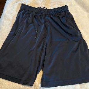 Nike Dri-Fit, men’s small with pockets, size small. Excellent condition.